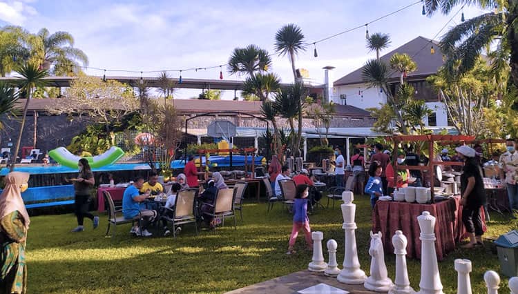 Enjoy a Buffet Style Breakfast in a Beautiful Garden of Klub Bunga Butik Resort Batu